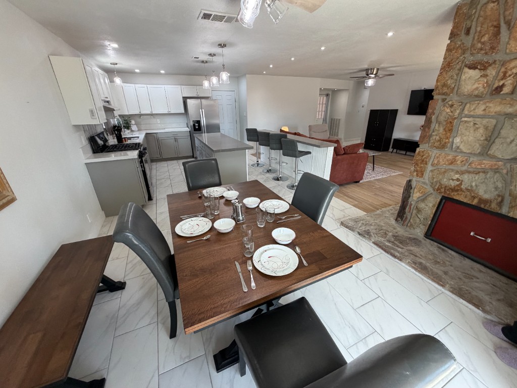 Dining room and kitchen at Christie's Place with table set for home-cooked meals